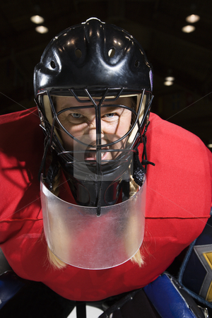 To use this stock image in your creative project, please select the size you need over to the right and click the "Add to Cart" button.
Your downloaded image will come with the Cutcaster watermark removed so don’t worry about the watermark you see on this page. Woman hockey goalie. stock photo, Woman hockey goalie wearing helmet sneering looking intimidating. by Iofoto Images