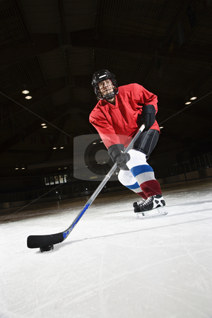 To use this stock image in your creative project, please select the size you need over to the right and click the "Add to Cart" button.
Your downloaded image will come with the Cutcaster watermark removed so don’t worry about the watermark you see on this page. Woman hockey player. stock photo, Woman hockey player skating on ice lining up to shoot puck. by Iofoto Images