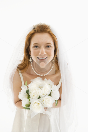To use this stock image in your creative project, please select the size you need over to the right and click the "Add to Cart" button.
Your downloaded image will come with the Cutcaster watermark removed so don’t worry about the watermark you see on this page. Bride holding bouquet. stock photo, Portrait of Caucasian bride holding bouquet. by Iofoto Images