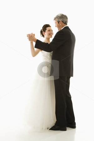 To use this stock image in your creative project, please select the size you need over to the right and click the "Add to Cart" button.
Your downloaded image will come with the Cutcaster watermark removed so don’t worry about the watermark you see on this page. Bride and groom dancing. stock photo, Portrait of Caucasian groom and Asian bride dancing. by Iofoto Images