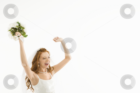 To use this stock image in your creative project, please select the size you need over to the right and click the "Add to Cart" button.
Your downloaded image will come with the Cutcaster watermark removed so don’t worry about the watermark you see on this page. Cheering bride. stock photo, Portrait of Caucasian bride holding bouquet and raising arms. by Iofoto Images
