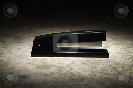 To use this stock image in your creative project, please select the size you need over to the right and click the "Add to Cart" button.
Your downloaded image will come with the Cutcaster watermark removed so don’t worry about the watermark you see on this page. Stapler. stock photo, Black stapler with black vignette. by Iofoto Images