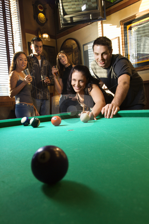 To use this stock image in your creative project, please select the size you need over to the right and click the "Add to Cart" button.
Your downloaded image will come with the Cutcaster watermark removed so don’t worry about the watermark you see on this page. Group playing billiards. stock photo, Young caucasian woman receiving advice on shooting pool ball while playing billiards. by Iofoto Images