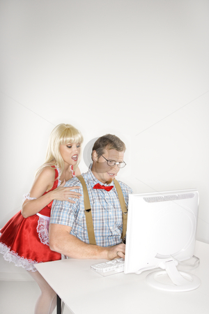 To use this stock image in your creative project, please select the size you need over to the right and click the "Add to Cart" button.
Your downloaded image will come with the Cutcaster watermark removed so don’t worry about the watermark you see on this page. Couple with computer. stock photo, Caucasian young man dressed like nerd with Caucasian young blonde woman dressed in french maid outfit looking over shoulder. by Iofoto Images