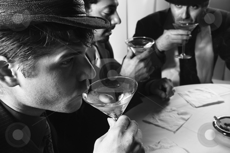 To use this stock image in your creative project, please select the size you need over to the right and click the "Add to Cart" button.
Your downloaded image will come with the Cutcaster watermark removed so don’t worry about the watermark you see on this page. Retro men drinking. stock photo, Three Caucasian prime adult males in retro suits sitting at table drinking cocktails. by Iofoto Images