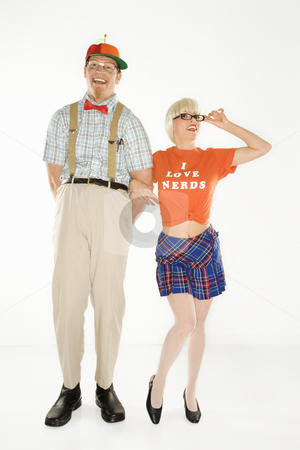To use this stock image in your creative project, please select the size you need over to the right and click the "Add to Cart" button.
Your downloaded image will come with the Cutcaster watermark removed so don’t worry about the watermark you see on this page. Nerd and beautiful woman. stock photo, Caucasian young man dressed like nerd wearing propeller hat with blonde Caucasian young woman in nerdy eyeglasses and tshirt reading I love nerds and plaid skirt. by Iofoto Images