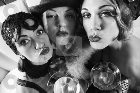 To use this stock image in your creative project, please select the size you need over to the right and click the "Add to Cart" button.
Your downloaded image will come with the Cutcaster watermark removed so don’t worry about the watermark you see on this page. Retro women with drinks. stock photo, Three retro prime adult Caucasian females out on the town. by Iofoto Images