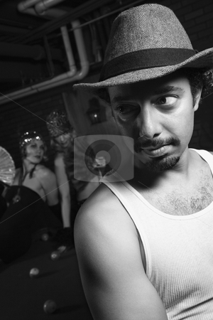 To use this stock image in your creative project, please select the size you need over to the right and click the "Add to Cart" button.
Your downloaded image will come with the Cutcaster watermark removed so don’t worry about the watermark you see on this page. Man dressed like retro gangster. stock photo, Caucasian prime adult retro male being checked out behind his back by two Caucasian prime adult retro females. by Iofoto Images