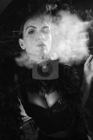 Retro female smoking. Retro female smoking. stock photo, Caucasian prime adult female smoking looking at viewer. by Iofoto Images