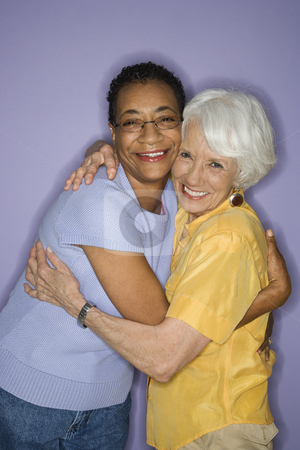 To use this stock image in your creative project, please select the size you need over to the right and click the "Add to Cart" button.
Your downloaded image will come with the Cutcaster watermark removed so don’t worry about the watermark you see on this page. Women embracing. stock photo, Caucasian and African American mature adult female embracing. by Iofoto Images