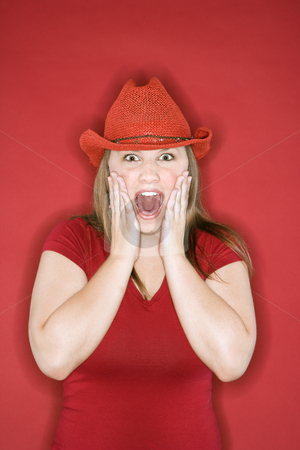 To use this stock image in your creative project, please select the size you need over to the right and click the "Add to Cart" button.
Your downloaded image will come with the Cutcaster watermark removed so don’t worry about the watermark you see on this page. Woman looking surprised and excited. stock photo, Young Caucasian female adult in red cowboy hat on red background with hands on face and mouth open. by Iofoto Images