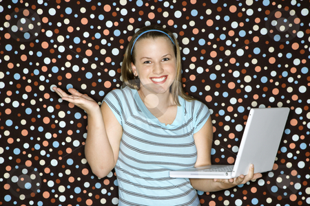 To use this stock image in your creative project, please select the size you need over to the right and click the "Add to Cart" button.
Your downloaded image will come with the Cutcaster watermark removed so don’t worry about the watermark you see on this page. Woman holding laptop computer. stock photo, Young Caucasian woman holding laptop shrugging and smiling. by Iofoto Images