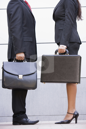 Cropped image of business meeting outside office Cropped image of business meeting outside office stock photo, Cropped image of business meeting outside modern office by Monkey Business Images
