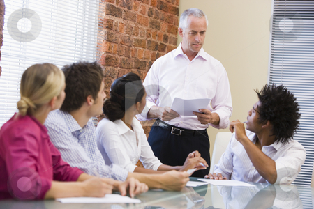 To use this stock image in your creative project, please select the size you need over to the right and click the "Add to Cart" button.
Your downloaded image will come with the Cutcaster watermark removed so don’t worry about the watermark you see on this page. Five businesspeople in boardroom meeting stock photo, by Monkey Business Images