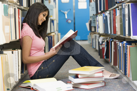 To use this stock image in your creative project, please select the size you need over to the right and click the "Add to Cart" button.
Your downloaded image will come with the Cutcaster watermark removed so don’t worry about the watermark you see on this page. University student working in library stock photo, Female student sitting on library floor surrounded by books by Monkey Business Images