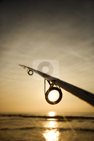 To use this stock image in your creative project, please select the size you need over to the right and click the "Add to Cart" button.
Your downloaded image will come with the Cutcaster watermark removed so don’t worry about the watermark you see on this page. Fishing pole with ocean. stock photo, Fishing pole against ocean at sunset. by Iofoto Images