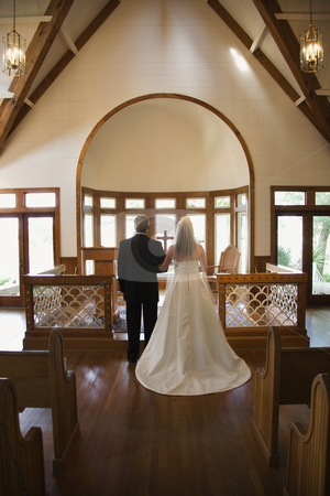 To use this stock image in your creative project, please select the size you need over to the right and click the "Add to Cart" button.
Your downloaded image will come with the Cutcaster watermark removed so don’t worry about the watermark you see on this page. Bride and groom. stock photo, Portrait of bride and groom at alter of a church. by Iofoto Images