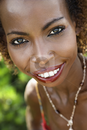 To use this stock image in your creative project, please select the size you need over to the right and click the "Add to Cart" button.
Your downloaded image will come with the Cutcaster watermark removed so don’t worry about the watermark you see on this page. Portrait of smiling woman. stock photo, Portrait of mid-adult African American female smiling and making eye contact. by Iofoto Images