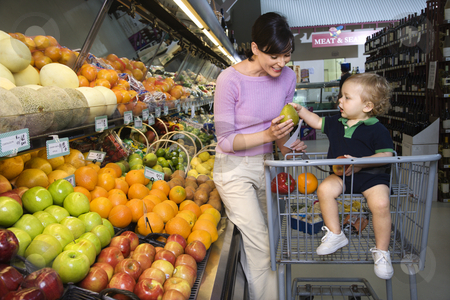 To use this stock image in your creative project, please select the size you need over to the right and click the "Add to Cart" button.
Your downloaded image will come with the Cutcaster watermark removed so don’t worry about the watermark you see on this page. Mother grocery shopping. stock photo, Caucasian mid-adult woman grocery shopping for fruit with young male toddler. by Iofoto Images