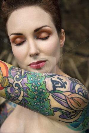 Nude tattooed woman stock