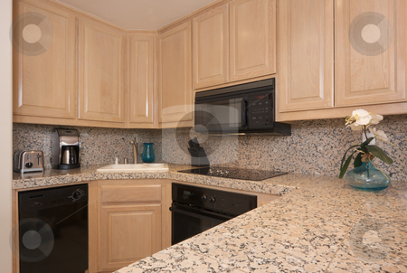 To use this stock image in your creative project, please select the size you need over to the right and click the "Add to Cart" button.
Your downloaded image will come with the Cutcaster watermark removed so don’t worry about the watermark you see on this page. Modern Kitchen Interior stock photo, Modern Kitchen Interior with Marble Countertop. by Andy Dean