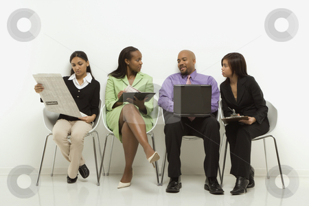 To use this stock image in your creative project, please select the size you need over to the right and click the "Add to Cart" button.
Your downloaded image will come with the Cutcaster watermark removed so don’t worry about the watermark you see on this page. Business group. stock photo, Multi-ethnic business group of men and women sitting looking at laptop and papers. by Iofoto Images