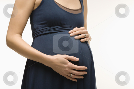 To use this stock image in your creative project, please select the size you need over to the right and click the "Add to Cart" button.
Your downloaded image will come with the Cutcaster watermark removed so don’t worry about the watermark you see on this page. Pregnant woman belly. stock photo, Caucasion mid-adult pregnant woman with hands on belly. by Iofoto Images