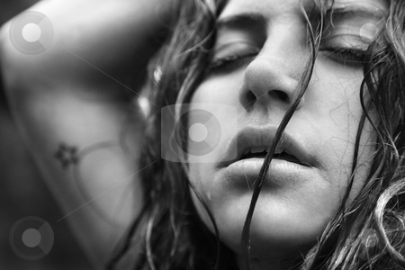 Portrait of woman. Portrait of woman. stock photo, Young adult Caucasian woman with disheveled hair and closed eyes. by Iofoto Images