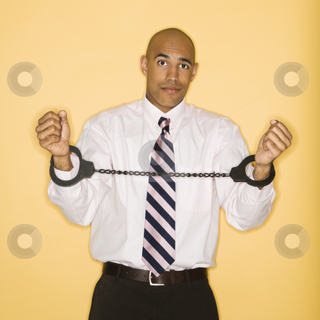 To use this stock image in your creative project, please select the size you need over to the right and click the "Add to Cart" button.
Your downloaded image will come with the Cutcaster watermark removed so don’t worry about the watermark you see on this page. Man in handcuffs. stock photo, African American man wearing handcuffs. by Iofoto Images