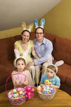 To use this stock image in your creative project, please select the size you need over to the right and click the "Add to Cart" button.
Your downloaded image will come with the Cutcaster watermark removed so don’t worry about the watermark you see on this page. Family at Easter. stock photo, Caucasian family wearing rabbit ears with Easter baskets looking at viewer. by Iofoto Images
