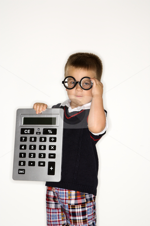 Boy child with calculator. Boy child with calculator. stock photo, Caucasian male child wearing glasses and holding large calculator. by Iofoto Images