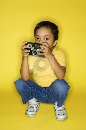 To use this stock image in your creative project, please select the size you need over to the right and click the "Add to Cart" button.
Your downloaded image will come with the Cutcaster watermark removed so don’t worry about the watermark you see on this page. Male child kneeling with camera. stock photo, Hispanic male child kneeling with camera. by Iofoto Images