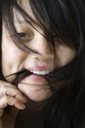 To use this stock image in your creative project, please select the size you need over to the right and click the "Add to Cart" button.
Your downloaded image will come with the Cutcaster watermark removed so don’t worry about the watermark you see on this page. Pretty young Asian woman. stock photo, Close up portrait of pretty young Asian woman biting her hair. by Iofoto Images