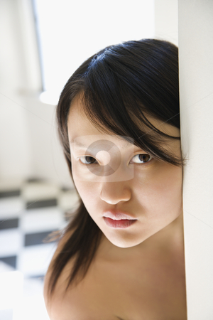 Pretty young Asian woman. Pretty young Asian woman. stock photo, Head and shoulder portrait of bare pretty young Asian woman making eye contact. by Iofoto Images