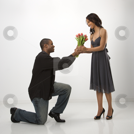 http://watermarked.cutcaster.com/cutcaster-photo-100144123-Man-giving-woman-flowers.jpg