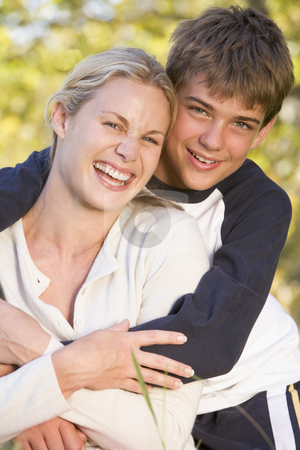 To use this stock image in your creative project, please select the size you need over to the right and click the "Add to Cart" button.
Your downloaded image will come with the Cutcaster watermark removed so don’t worry about the watermark you see on this page. Woman and young boy embracing outdoors and smiling stock photo, by Monkey Business Images