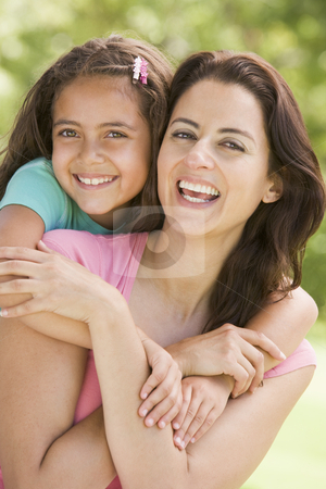 To use this stock image in your creative project, please select the size you need over to the right and click the "Add to Cart" button.
Your downloaded image will come with the Cutcaster watermark removed so don’t worry about the watermark you see on this page. Woman and young girl embracing outdoors smiling stock photo, by Monkey Business Images