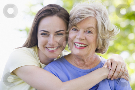 To use this stock image in your creative project, please select the size you need over to the right and click the "Add to Cart" button.
Your downloaded image will come with the Cutcaster watermark removed so don’t worry about the watermark you see on this page. Two women outdoors smiling stock photo, by Monkey Business Images
