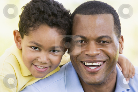 To use this stock image in your creative project, please select the size you need over to the right and click the "Add to Cart" button.
Your downloaded image will come with the Cutcaster watermark removed so don’t worry about the watermark you see on this page. Man and young boy outdoors smiling stock photo, by Monkey Business Images