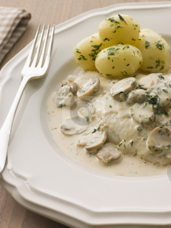 Whole Dover Sole Bonne Femme with pomme nouvelle Whole Dover Sole Bonne Femme with pomme nouvelle stock photo, by Monkey Business Images