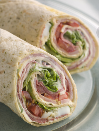 To use this stock image in your creative project, please select the size you need over to the right and click the "Add to Cart" button.
Your downloaded image will come with the Cutcaster watermark removed so don’t worry about the watermark you see on this page. Deli Tortilla Wrap Cut in Half stock photo, by Monkey Business Images