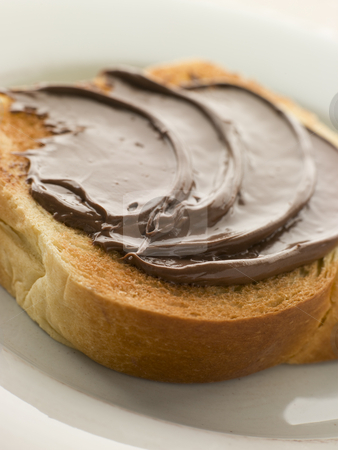 To use this stock image in your creative project, please select the size you need over to the right and click the "Add to Cart" button.
Your downloaded image will come with the Cutcaster watermark removed so don’t worry about the watermark you see on this page. Slice of Toasted brioche with Chocolate Spread stock photo, by Monkey Business Images