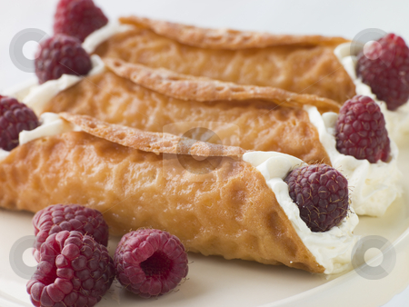 Cream Brandy Snaps with Raspberries Cream Brandy Snaps with Raspberries stock photo, by Monkey Business Images