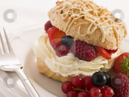 Choux Bun filled with Mixed Berries and Chantilly Cream Choux Bun filled with Mixed Berries and Chantilly Cream stock photo, by Monkey Business Images