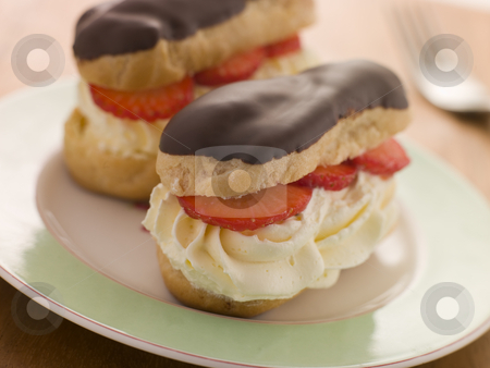 Chocolate and Strawberry filled eclairs Chocolate and Strawberry filled eclairs stock photo, by Monkey Business Images