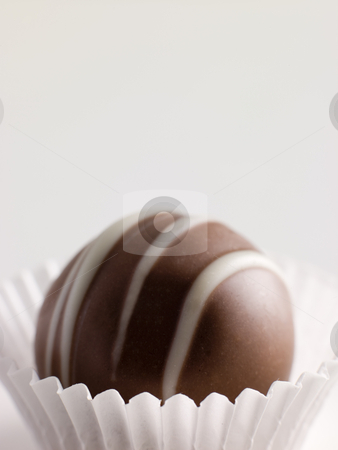 To use this stock image in your creative project, please select the size you need over to the right and click the "Add to Cart" button.
Your downloaded image will come with the Cutcaster watermark removed so don’t worry about the watermark you see on this page. Chocolate Truffle in a Petit four Case stock photo, by Monkey Business Images