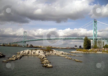 To use this stock image in your creative project, please select the size you need over to the right and click the "Add to Cart" button.
Your downloaded image will come with the Cutcaster watermark removed so don’t worry about the watermark you see on this page. Ambassador Bridge stock photo, International Ambassador Bridge over the Detroit River between United States and Canada. The bridge spans Detroit Michigan and Windsor Ontario. Photograph taken on the Canadian side. by Mehahatollahh Livingstone