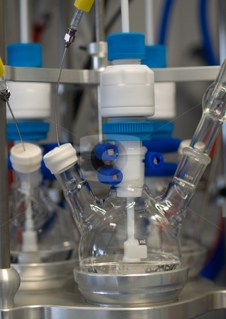 To use this stock image in your creative project, please select the size you need over to the right and click the "Add to Cart" button.
Your downloaded image will come with the Cutcaster watermark removed so don’t worry about the watermark you see on this page. Chemical reaction stock photo, Chemical reaction setup in a chemistry research lab by Laurent Dambies