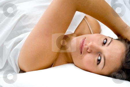 To use this stock image in your creative project, please select the size you need over to the right and click the "Add to Cart" button.
Your downloaded image will come with the Cutcaster watermark removed so don’t worry about the watermark you see on this page. Attractive young woman lounging in bed stock photo, Attractive young woman lounging in bed by Vince Clements