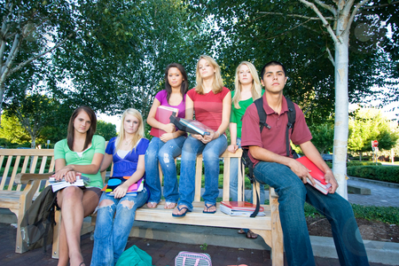To use this stock image in your creative project, please select the size you need over to the right and click the "Add to Cart" button.
Your downloaded image will come with the Cutcaster watermark removed so don’t worry about the watermark you see on this page. Group of Students - Horizontal stock photo, Group of five high school girls and one boy sitting on a bench holding books and frowning. Horizontally framed photo. by Orange Line Media